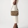 Guess NOELLE II MINI BAG - Handbag - Latte/brown