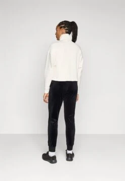 Guess COUTURE JOGGER PANTS - Tracksuit Bottoms - Jet Black -Guess Clothing Sale b935c5cd119b470692e641829bcbb6ac