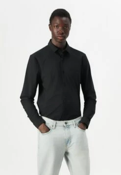 RELAXED TAPER - Jeans Tapered Fit - Light Blue Denim -Guess Clothing Sale e170753a192f42828dc6fd0f575c53da